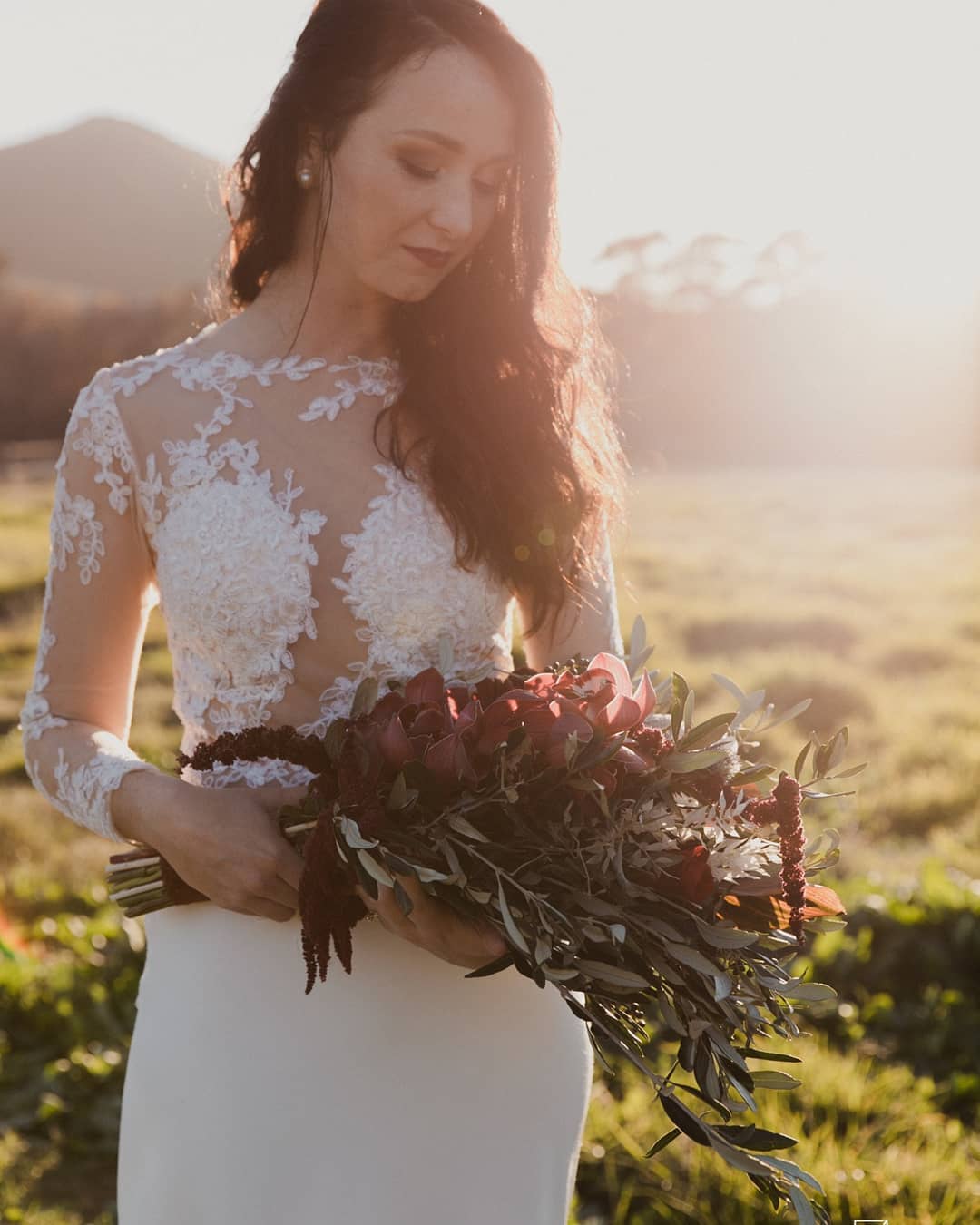 juliana Lace Bodice & Crepe Mermaid Gown with Sheer Sleeves The Juliana gown is a timeless blend of refined sophistication and modern romance. Featuring a delicate sheer lace bodice and a sleek crepe mermaid skirt, this design is perfect for the bride who desires elegance, structure, and just the right amount of drama. ✨ Design Highlights: ✔ Sheer Lace Bodice – Intricate lace appliqués placed over soft illusion tulle for a romantic and lightweight feel. ✔ Long Lace Sleeves – Fitted and sheer, offering coverage with elegance, ideal for cooler seasons or classic bridal style. ✔ Button Closure Back – A row of bridal buttons along the back adds timeless charm and refinement. ✔ Fitted Crepe Mermaid Skirt – Smooth, figure-enhancing crepe flares beautifully from the knees for a graceful silhouette. ✔ Long Flowing Train – Creates a dramatic and unforgettable bridal entrance. 💫 Customization Options: ✅ Custom sizing tailored to your shape ✅ Option to adjust sleeve length or add a satin lining under the lace ✅ Available in soft white, ivory, or off-white tones ✅ Add a matching lace veil or detachable overskirt for added drama 👰 Juliana is for the bride who seeks a look of refined grace—where every curve, lace motif, and train flows with poise and quiet beauty. 👰 📞 Schedule your consultation or fitting today! 📧 info@bestersbridal.co.za | 📱 084 268 1354