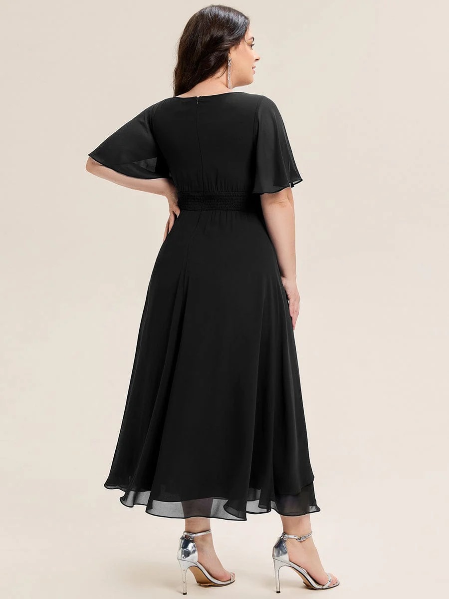 Lilou A beautifully pleated chiffon midi dress designed for plus-size elegance, featuring soft ruffle sleeves and a flattering flowy silhouette — perfect for any special celebration. This dress is not currently in stock but is available to order.