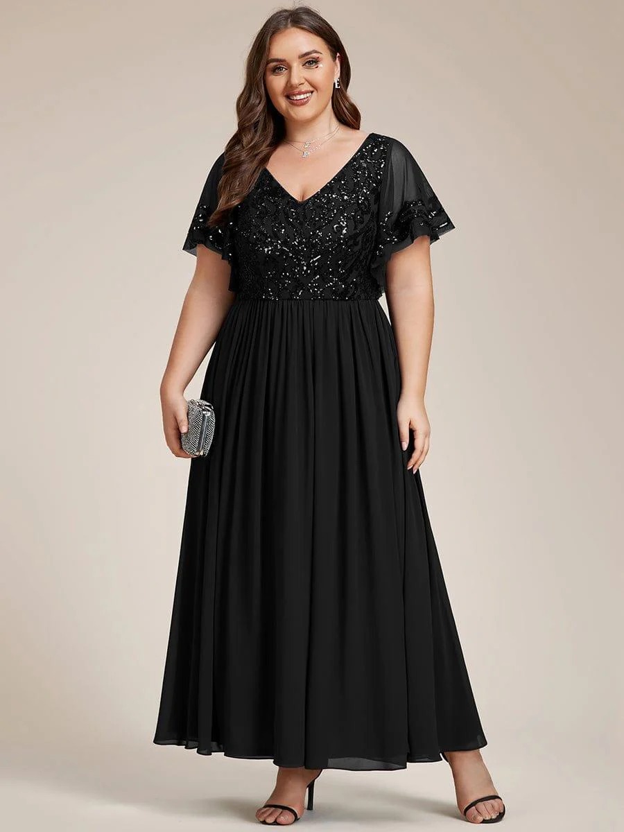 Hazel A sophisticated Mother of the Bride dress featuring a sparkling sequin V-neck bodice, soft short sleeves, and a smooth, flowing skirt for timeless elegance. This dress is not currently in stock but is available to order.