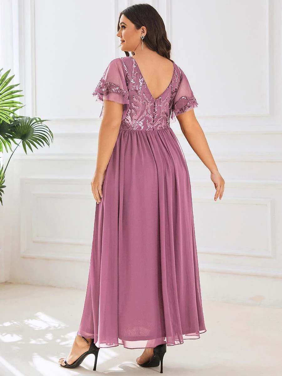 Hazel A sophisticated Mother of the Bride dress featuring a sparkling sequin V-neck bodice, soft short sleeves, and a smooth, flowing skirt for timeless elegance. This dress is not currently in stock but is available to order.