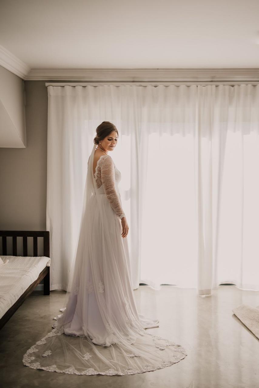 savannah Chiffon & Chantilly Lace Wedding Dress with Modern Elegance The Savannah gown is a timeless and effortlessly elegant choice for the bride who wants soft movement and subtle lace detail. Designed with a flattering square neckline and a beautifully fitted bodice, this dress combines clean lines with delicate Chantilly lace for a look that’s both refined and romantic. ✨ Design Highlights: ✔ Square Neckline Bodice – Structured and modern, offering a flattering silhouette with elegant simplicity. ✔ Chantilly Lace Back – Sheer lace detailing at the back bodice adds a romantic and graceful touch. ✔ Chiffon Full-Flare Skirt with Pockets – Flowing chiffon skirt that moves with ease, featuring hidden pockets for comfort and practicality. ✔ Lace Sleeves with Trim – Soft Chantilly lace sleeves trimmed with delicate lace edging for subtle detailing. ✔ Zip-Up Back – A secure closure that maintains a smooth, clean fit across the bodice. ✔ No Train / Optional Short Train – Lightweight and graceful for ease of movement and relaxed elegance. 💫 Customization Options: ✅ Custom sizing tailored to your measurements ✅ Option to change sleeve length or remove sleeves entirely ✅ Available with or without a short chiffon train ✅ Choose from soft white or off-white chiffon and lace 🌿 Savannah is designed for the bride who desires a naturally graceful gown—simple, breathable, and thoughtfully refined. 🌿 📞 Book your custom consultation today! 📧 info@bestersbridal.co.za | 📱 084 268 1354 Chiffon Skirt • Square Neckline • Chantilly Lace Back • Lace Sleeves • Pockets • Lightweight Elegance